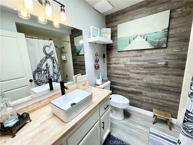 3332 Shamrock Pl, Merced, CA 95340 - full bath with vanity, wood walls, curtained shower, and wood finished floors