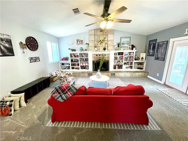 3332 Shamrock Pl, Merced, CA 95340 - carpeted living room featuring lofted ceiling, a ceiling fan, and a tiled fireplace