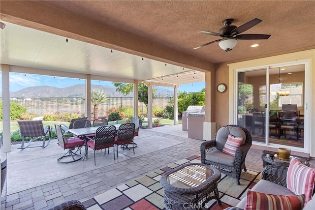 44655 Howell Mountain St, Temecula, CA 92592 - view of patio with area for grilling, outdoor dining area, ceiling fan, and a mountain view