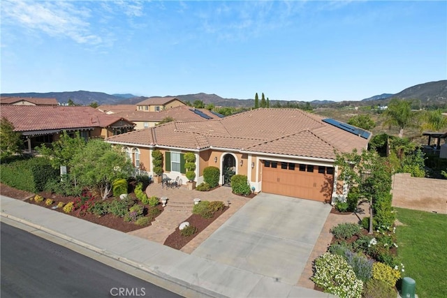 44655 Howell Mountain St, Temecula, CA 92592 - mediterranean / spanish-style house with a garage, a tiled roof, concrete driveway, and a mountain view