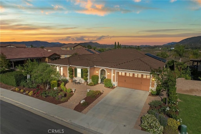 44655 Howell Mountain St, Temecula, CA 92592 - mediterranean / spanish-style home featuring a garage, a tiled roof, a mountain view, and driveway