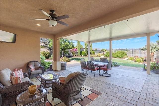 44655 Howell Mountain St, Temecula, CA 92592 - fenced backyard featuring outdoor dining space, a patio area, a ceiling fan, and outdoor lounge area