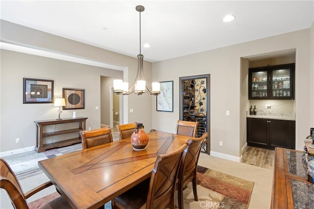 44655 Howell Mountain St, Temecula, CA 92592 - dining room featuring a chandelier, light carpet, bar area, and recessed lighting