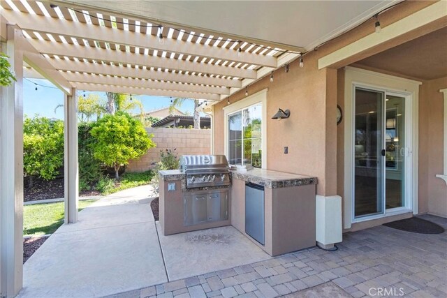 44655 Howell Mountain St, Temecula, CA 92592 - view of patio / terrace featuring exterior kitchen and a pergola