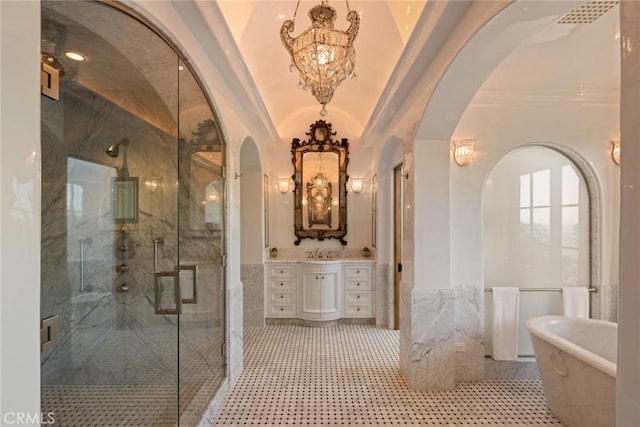36 Pelican Crest Dr, Newport Coast, CA 92657 - full bath with a freestanding bath, a chandelier, vanity, a marble finish shower, and a wainscoted wall