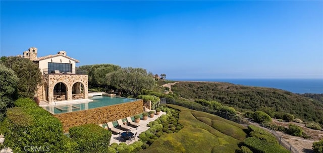36 Pelican Crest Dr, Newport Coast, CA 92657 - view of pool featuring an outdoor fireplace, a patio, and an infinity pool