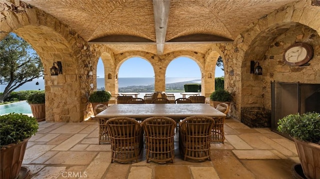 36 Pelican Crest Dr, Newport Coast, CA 92657 - view of patio / terrace with an outdoor stone fireplace, outdoor dining space, and a water view