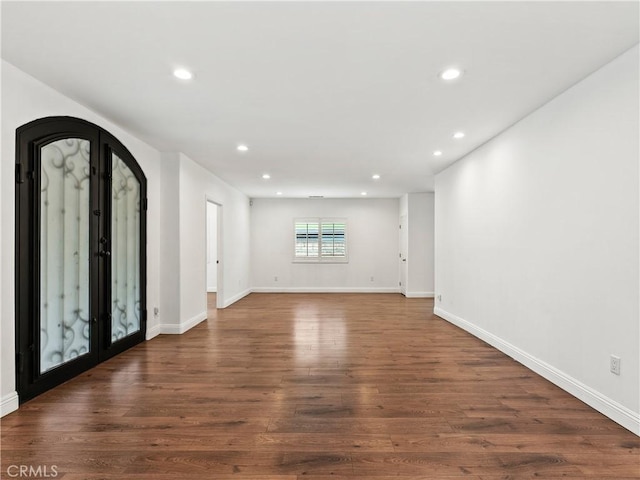 2128 E 3rd St, Los Angeles, CA 90033 - foyer with recessed lighting, dark wood-type flooring, and arched walkways
