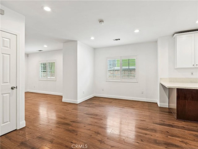 2128 E 3rd St, Los Angeles, CA 90033 - unfurnished living room featuring healthy amount of natural light, dark wood-type flooring, and recessed lighting