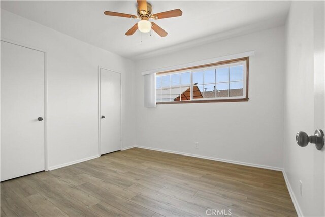 3857 W 135th, Hawthorne, CA 90250 - unfurnished bedroom with wood finished floors and a ceiling fan