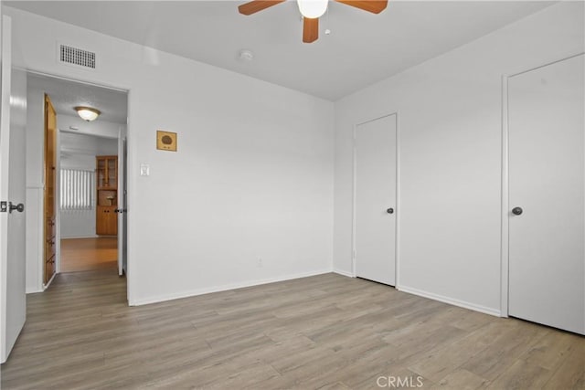 3857 W 135th, Hawthorne, CA 90250 - unfurnished bedroom featuring wood finished floors and a ceiling fan