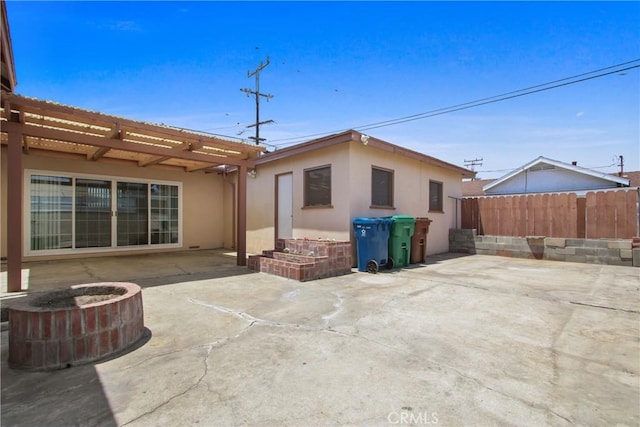 3857 W 135th, Hawthorne, CA 90250 - rear view of house featuring stucco siding, a patio area, and a pergola