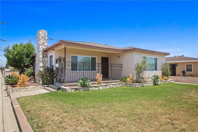 3857 W 135th, Hawthorne, CA 90250 - view of front of house with a front lawn, stucco siding, and a chimney