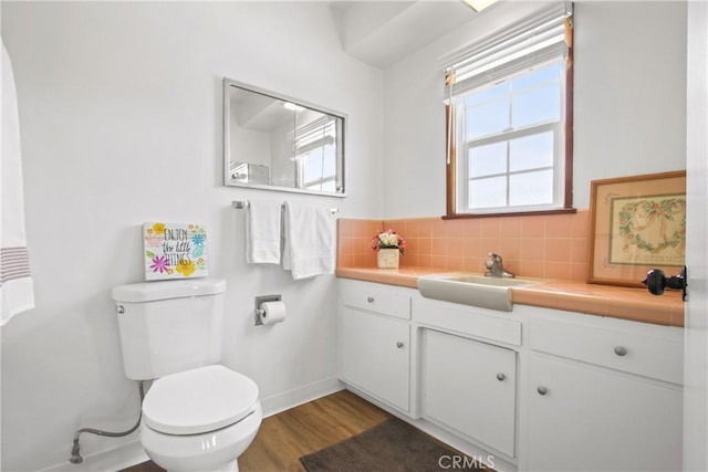 3857 W 135th, Hawthorne, CA 90250 - bathroom featuring vanity, wood finished floors, and tasteful backsplash