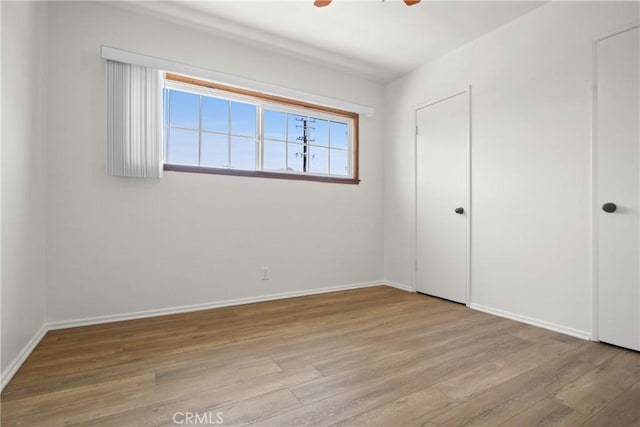 3857 W 135th, Hawthorne, CA 90250 - unfurnished bedroom featuring wood finished floors and ceiling fan