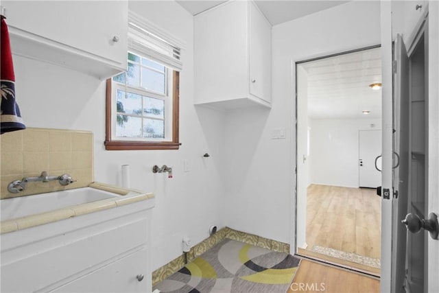 3857 W 135th, Hawthorne, CA 90250 - laundry area with a sink and wood finished floors