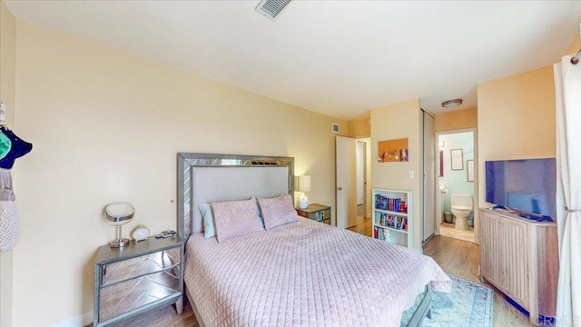 1110 Benjamin Pl, El Cajon, CA 92020 - bedroom featuring wood finished floors and ensuite bath