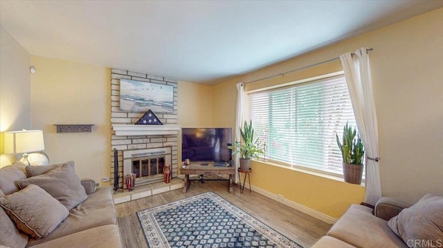 1110 Benjamin Pl, El Cajon, CA 92020 - living area with wood finished floors and a stone fireplace