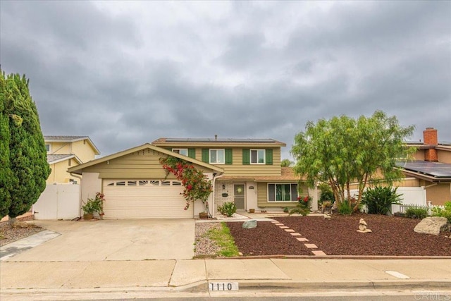 1110 Benjamin Pl, El Cajon, CA 92020 - traditional-style house featuring a garage, solar panels, and concrete driveway