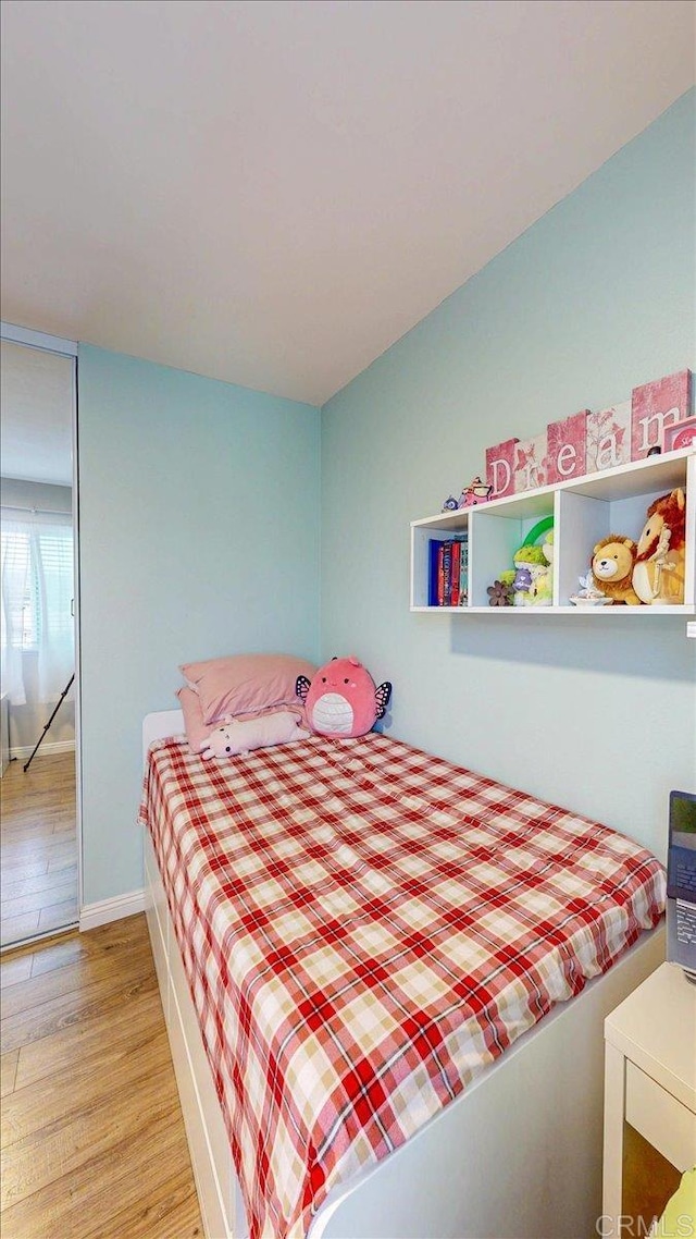 1110 Benjamin Pl, El Cajon, CA 92020 - bedroom with light wood finished floors and baseboards