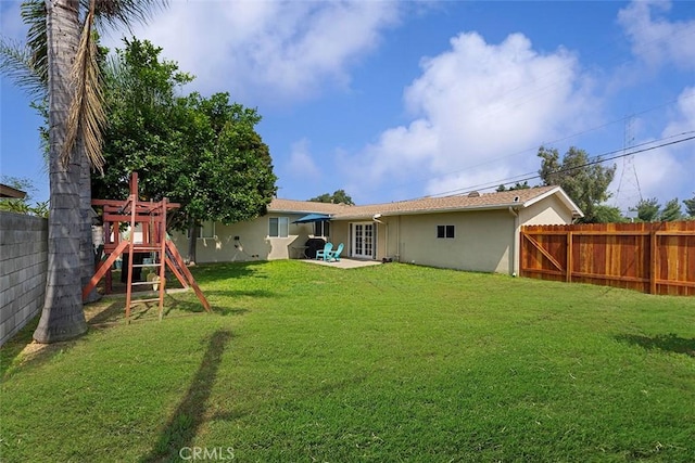1200 S Pennsylvania Ave, Glendora, CA 91740 - rear view of property with a playground, stucco siding, a fenced backyard, and french doors