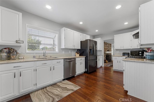 1200 S Pennsylvania Ave, Glendora, CA 91740 - kitchen featuring black appliances, dark wood finished floors, decorative backsplash, white cabinets, and wall chimney exhaust hood