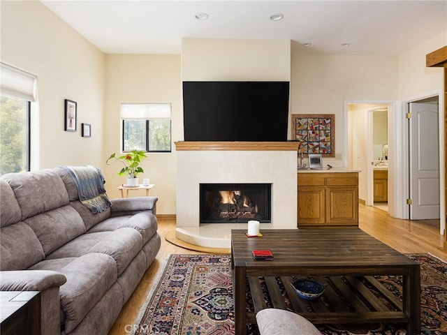 715 W Palm Ave, El Segundo, CA 90245 - living area featuring plenty of natural light, light wood finished floors, a high end fireplace, and recessed lighting