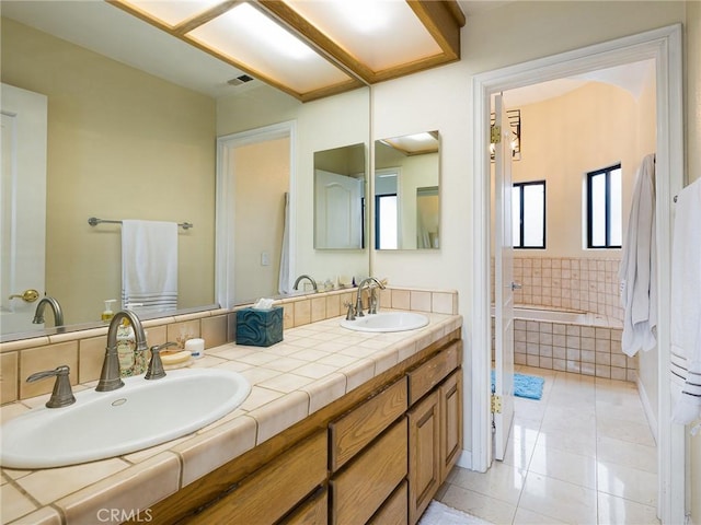 715 W Palm Ave, El Segundo, CA 90245 - full bathroom with double vanity, tile patterned floors, and tiled tub