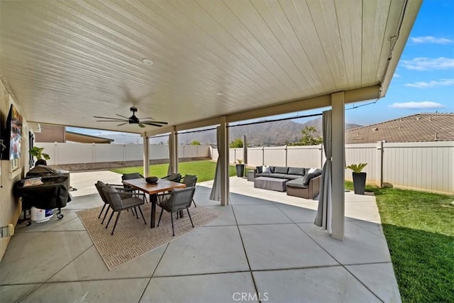 20909 Spring St, Riverside, CA 92507 - fenced backyard with an outdoor hangout area, a patio area, outdoor dining space, grilling area, and a ceiling fan