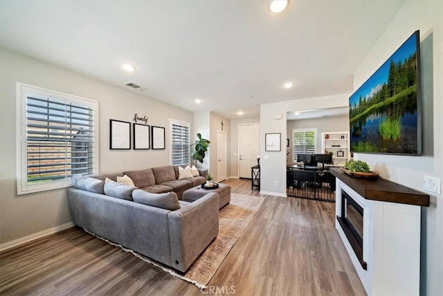 20909 Spring St, Riverside, CA 92507 - living area with light wood-style flooring and recessed lighting
