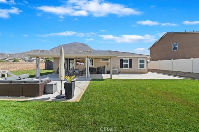 20909 Spring St, Riverside, CA 92507 - rear view of house with an outdoor living space, a patio area, and a fenced backyard