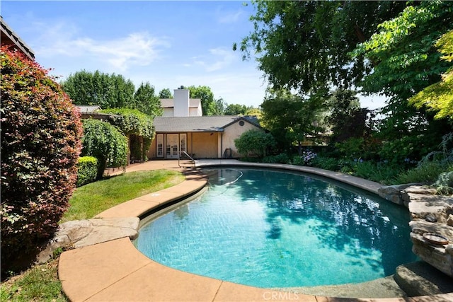 1013 Arbutus Ave, Chico, CA 95926 - outdoor pool with french doors and a patio area