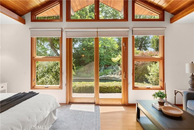 1013 Arbutus Ave, Chico, CA 95926 - bedroom with a wood ceiling with exposed beams, access to exterior, wood finished floors, and high vaulted ceiling