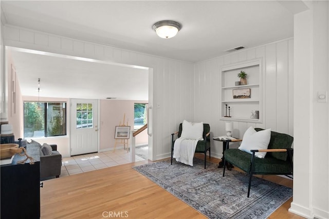 1013 Arbutus Ave, Chico, CA 95926 - sitting room featuring light wood finished floors and built in shelves