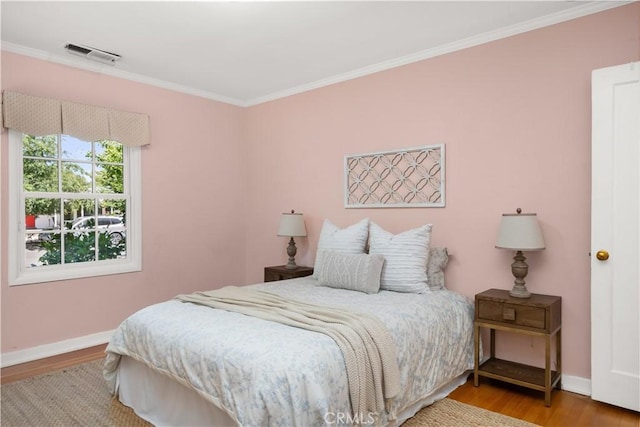 1013 Arbutus Ave, Chico, CA 95926 - bedroom featuring crown molding and wood finished floors