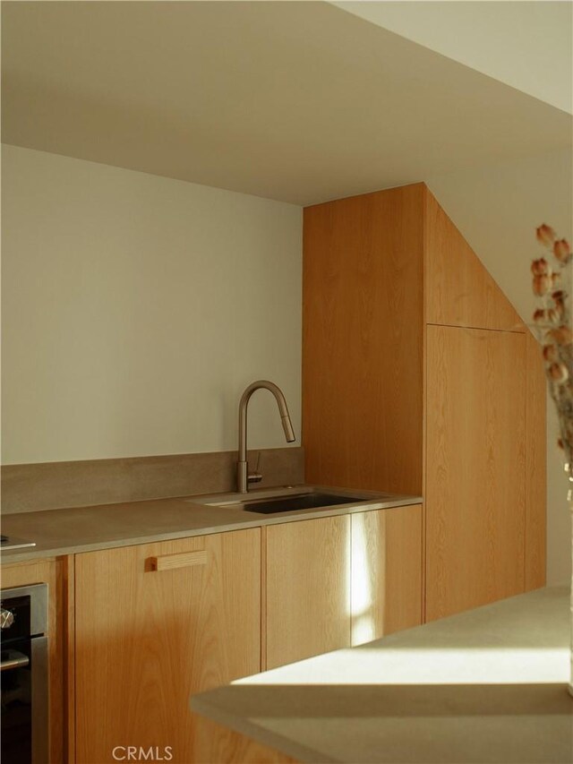 1807 Montana St, Los Angeles, CA 90026 - kitchen with oven, light brown cabinetry, and light countertops