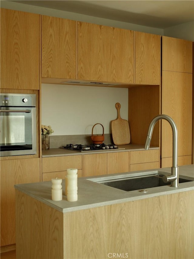1807 Montana St, Los Angeles, CA 90026 - kitchen with oven, modern cabinets, gas cooktop, and light countertops