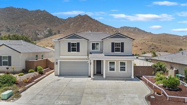 20697 Bison Mesa Rd, Riverside, CA 92507 - traditional home with a mountain view, stucco siding, a garage, and concrete driveway