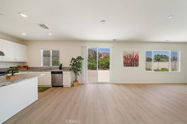 20697 Bison Mesa Rd, Riverside, CA 92507 - kitchen with dishwasher, light wood-style floors, white cabinetry, plenty of natural light, and recessed lighting