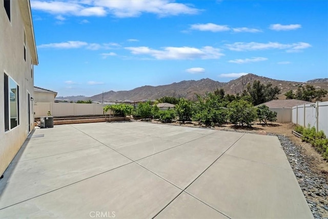 20697 Bison Mesa Rd, Riverside, CA 92507 - fenced backyard with a mountain view and a patio area
