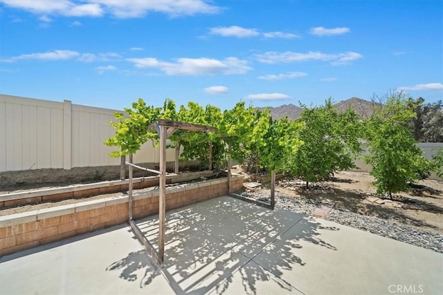 20697 Bison Mesa Rd, Riverside, CA 92507 - fenced backyard with a patio and a mountain view