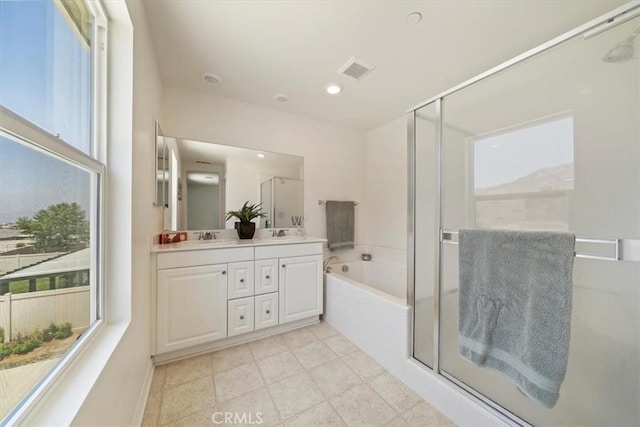 20697 Bison Mesa Rd, Riverside, CA 92507 - full bath featuring healthy amount of natural light, double vanity, a garden tub, and a shower stall