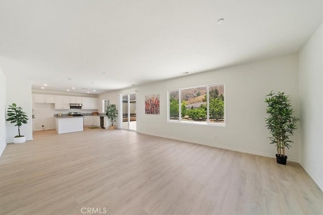 20697 Bison Mesa Rd, Riverside, CA 92507 - unfurnished living room with light wood finished floors and recessed lighting