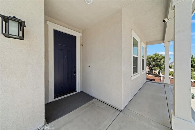 20697 Bison Mesa Rd, Riverside, CA 92507 - entrance to property with stucco siding and a surveillance system