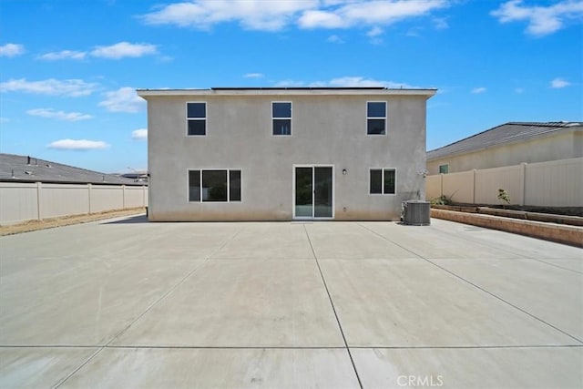 20697 Bison Mesa Rd, Riverside, CA 92507 - rear view of house with stucco siding, a fenced backyard, and a patio
