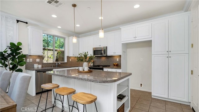 233 Bright Poppy, Irvine, CA 92618 - kitchen featuring stainless steel appliances, open shelves, light tile patterned flooring, white cabinetry, and decorative backsplash