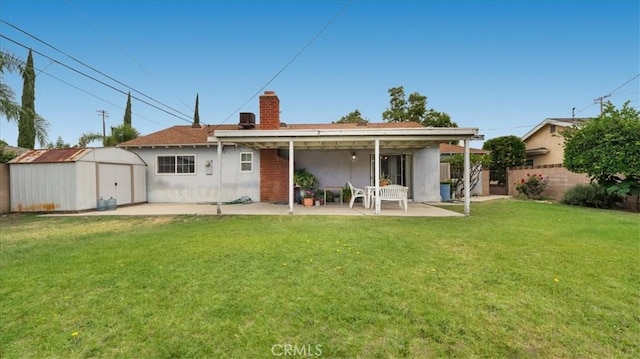 5007 Walnut Ave, Chino, CA 91710 - back of property with a patio area, a shed, a chimney, and stucco siding