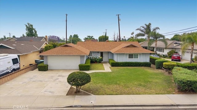 5007 Walnut Ave, Chino, CA 91710 - single story home with concrete driveway, a front lawn, an attached garage, a residential view, and board and batten siding