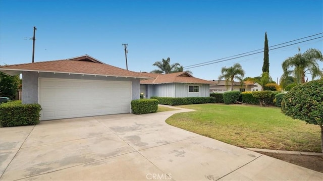 5007 Walnut Ave, Chino, CA 91710 - single story home with driveway, a front yard, a garage, stucco siding, and a shingled roof
