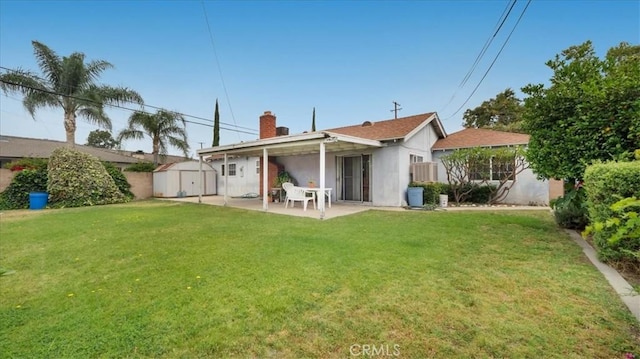 5007 Walnut Ave, Chino, CA 91710 - back of property featuring a storage shed, a patio area, a yard, and a chimney
